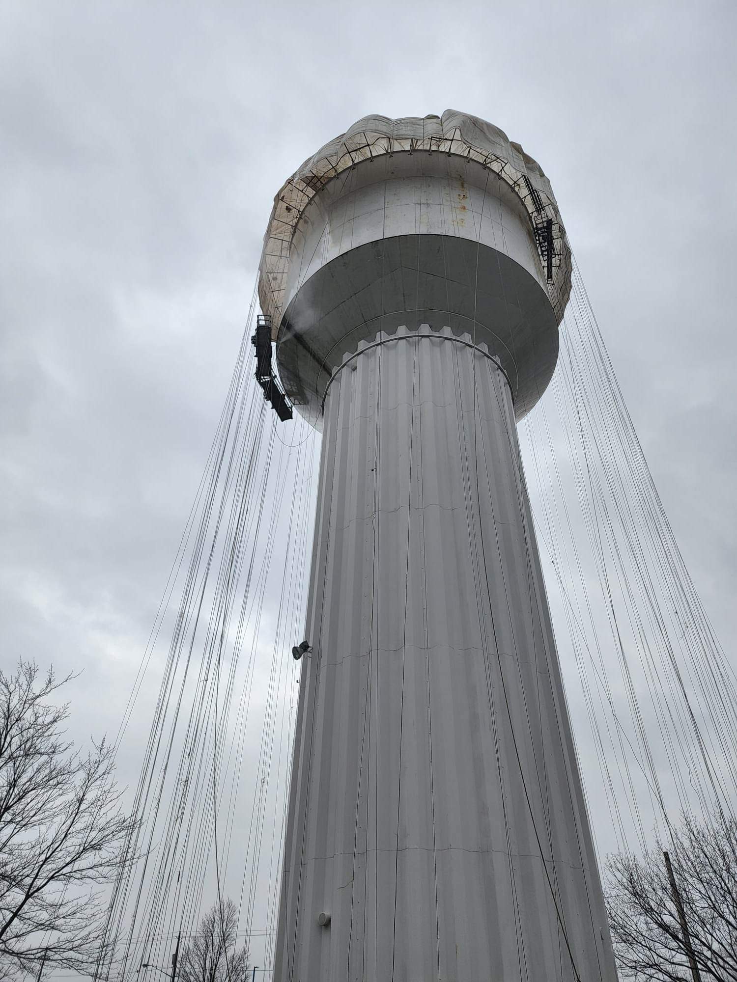 Exterior containment wrap on water tower — JCR Industrial Coatings